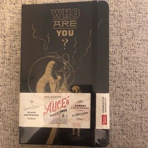 Moleskine Alice in Wonderland plain notebook.